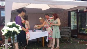 In this sand pouring ceremony, gin lovers Aubrey and Stephanie used a gin bottle from a local distillery